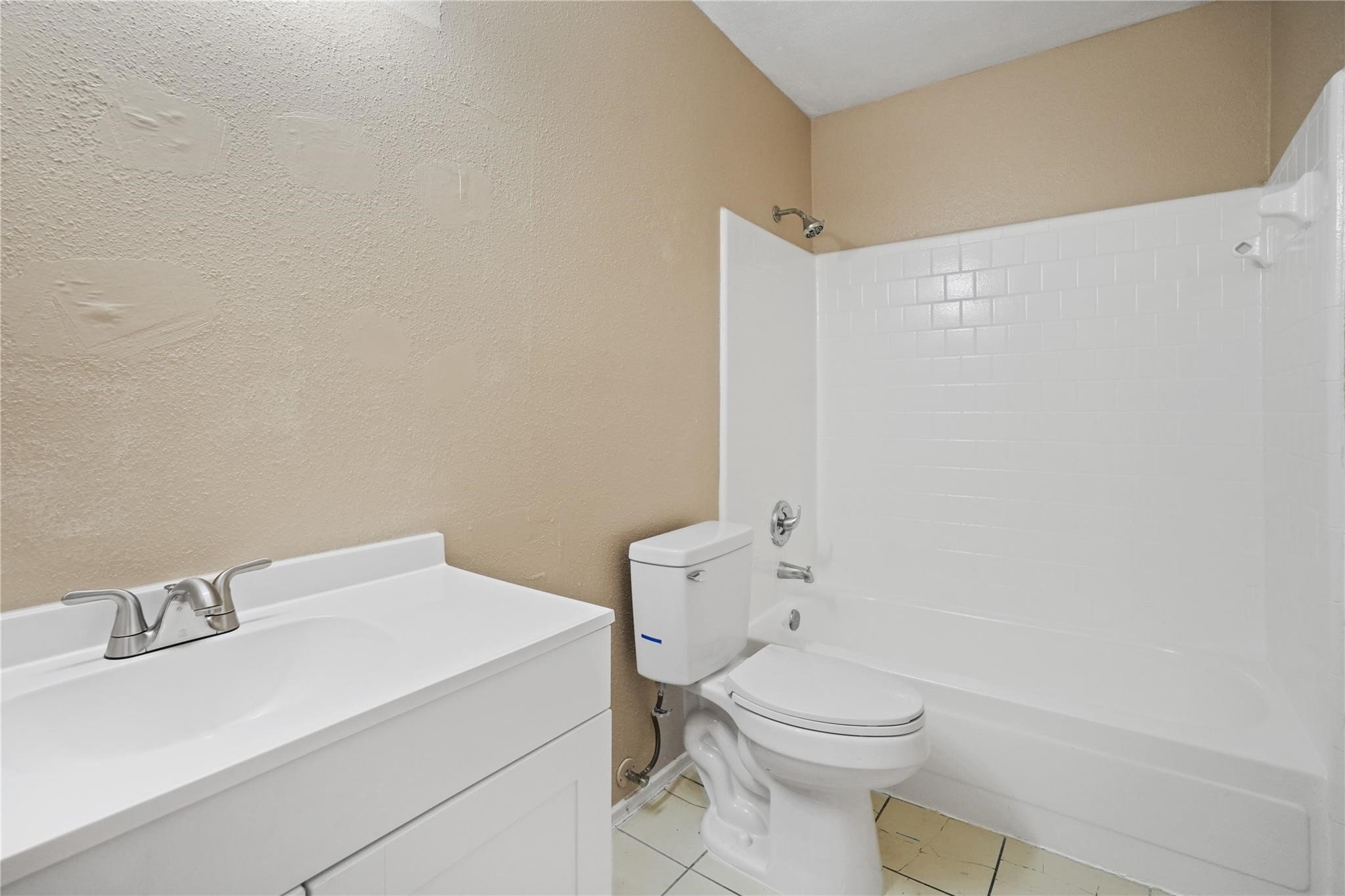 22911 Sherioaks Lane Spring, TX 77389 - Photo 15 of 22 a white toilet sitting next to a bathroom sink