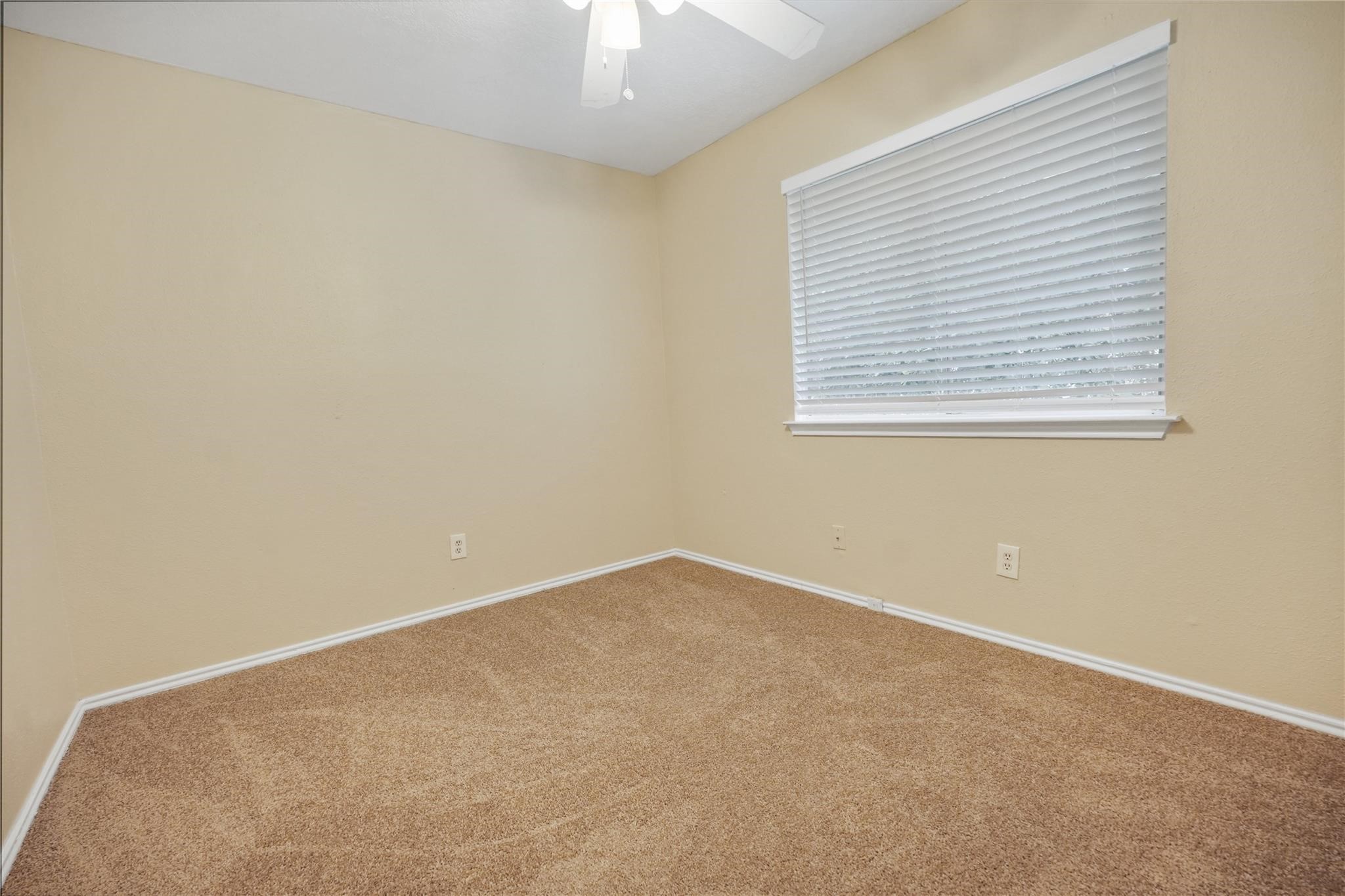 22911 Sherioaks Lane Spring, TX 77389 - Photo 16 of 22 an empty room with a window