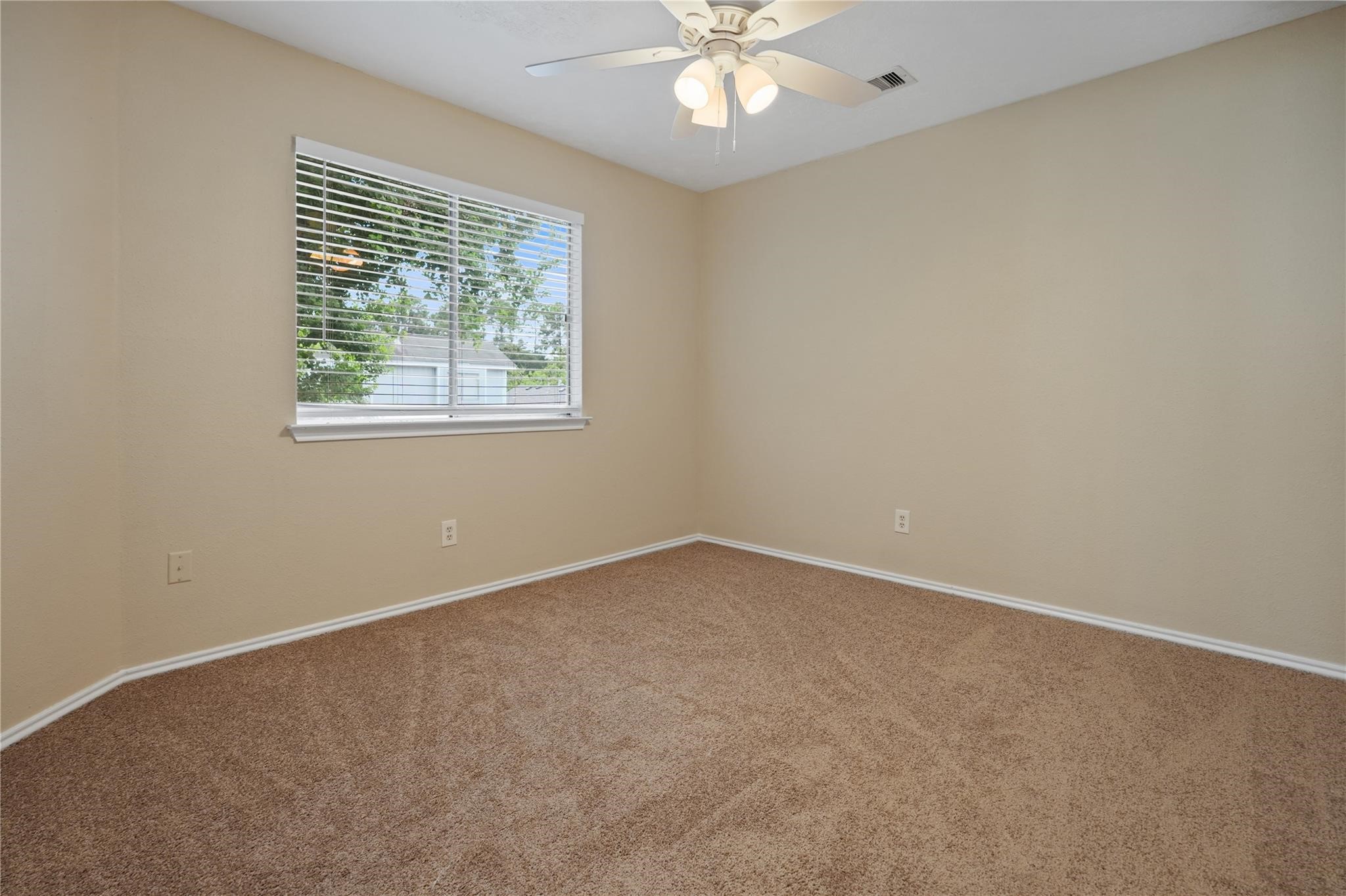 22911 Sherioaks Lane Spring, TX 77389 - Photo 20 of 22 an empty room with a window