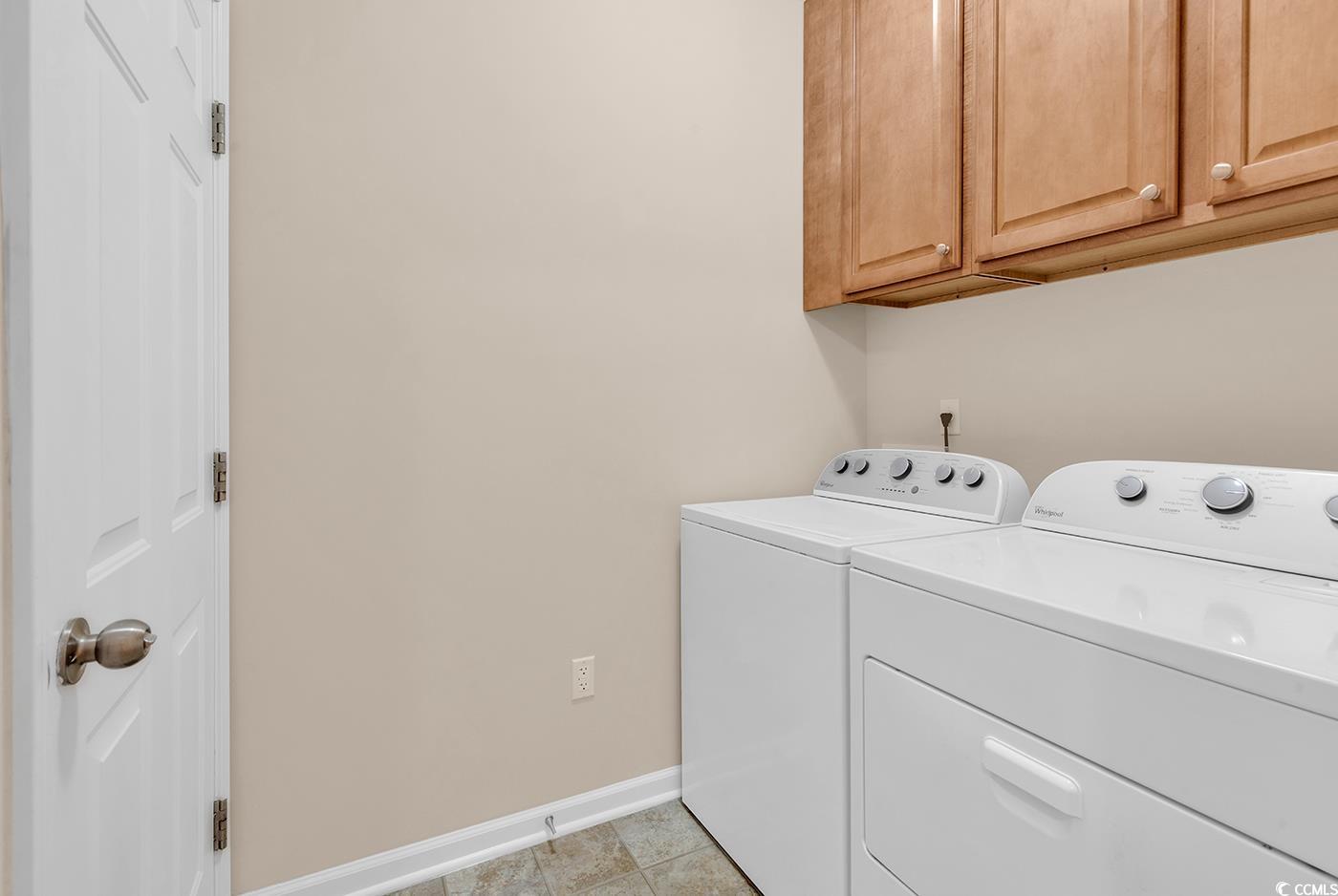 1612 Fairforest Court Conway, SC 29526 - Photo 34 of 40 Laundry area featuring independent washer and dryer, cabinet space, and light tile patterned flooring