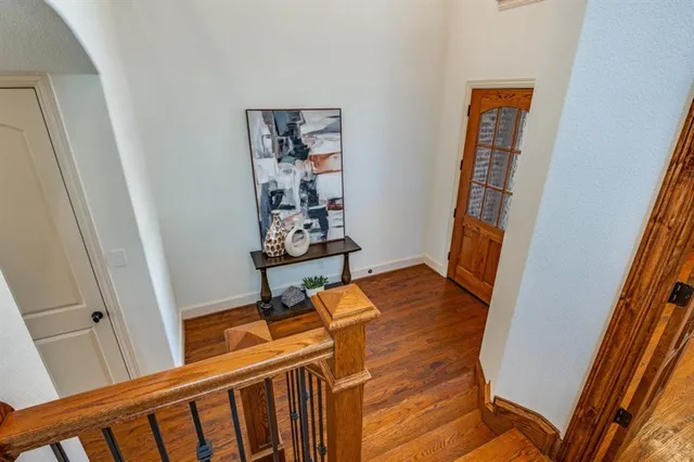 a view of an entryway with wooden floor