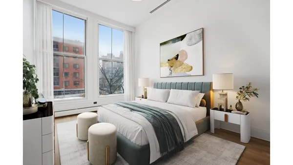 a living room with furniture windows and wooden floor