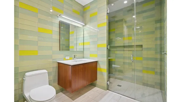 a bathroom with a shower and a sink