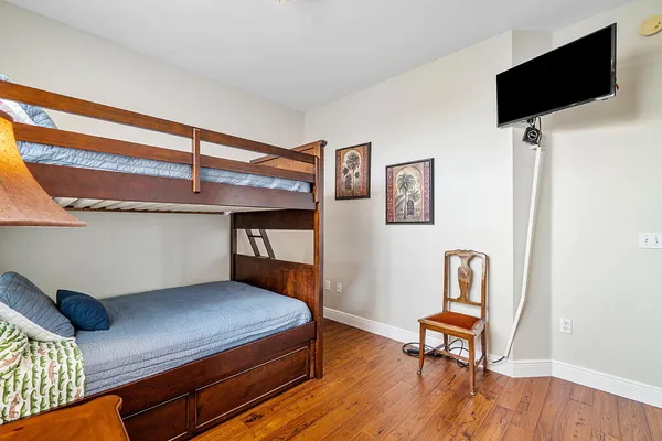 a room that has a bed and a table in it