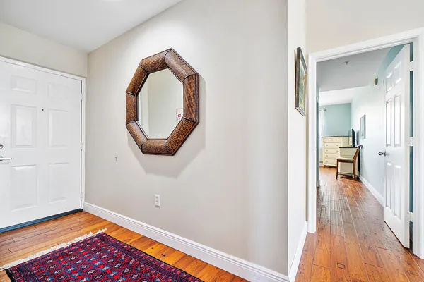 wooden floor in a hall with an entryway