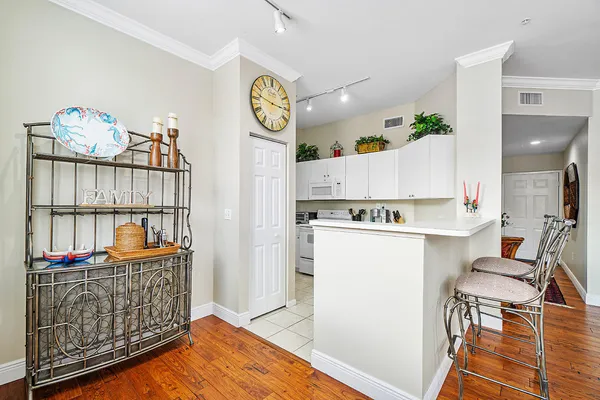 a kitchen with cabinets and white appliances