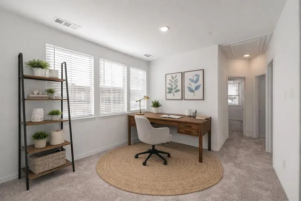 a workspace with furniture and window