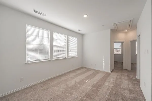 a view of an empty room with a window