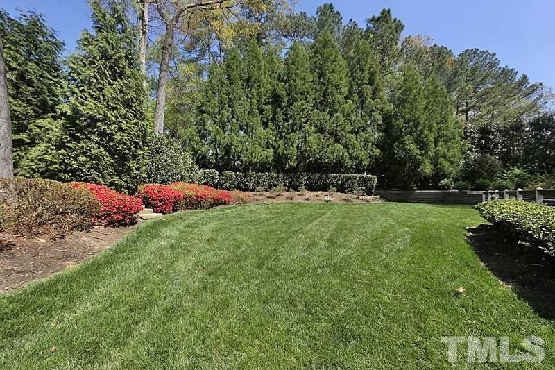 4310 Swarthmore Road Durham, NC 27707 - Photo 3 of 23 Beautifully landscaped yard, with perennials, trees, shrubs and lawn. Irrigation system keeps it looking lush and green.