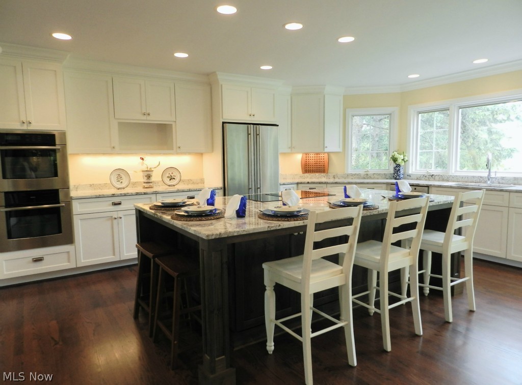 34000 Cedar Road Chagrin Falls, OH 44022 - Photo 3 of 24 Beautifully renovated kitchen with white granite, stainless appliances. Island seats 5.