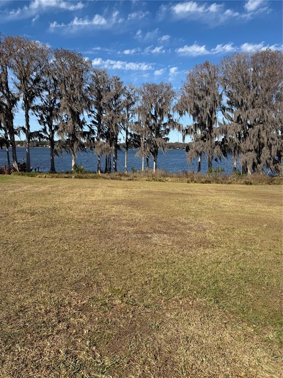 550 San Remo Circle Inverness, FL 34450 - Photo 2 of 6 a view of a large body of water with lots of trees