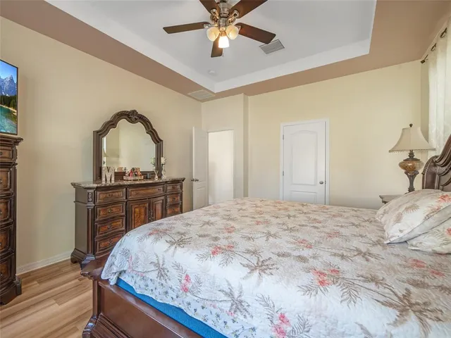 a bedroom with a bed and a dresser