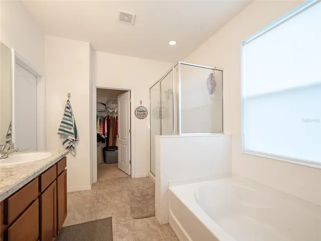a bathroom with a bathtub and a sink