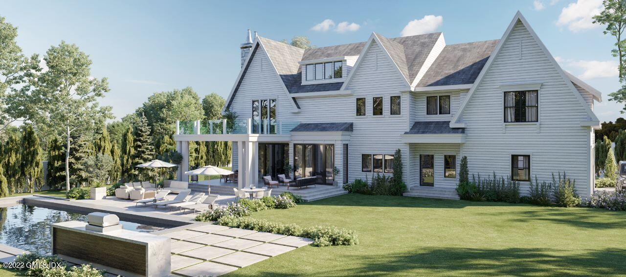 20 MacKenzie Glen Greenwich, CT 06830 - Photo 3 of 8 a front view of a house with garden