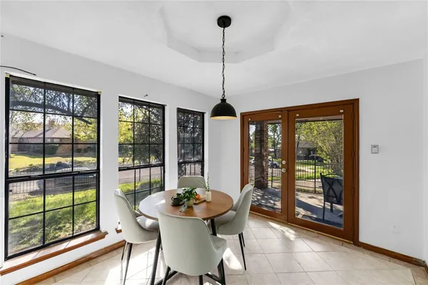 a view of a dining room with furniture window and outside view