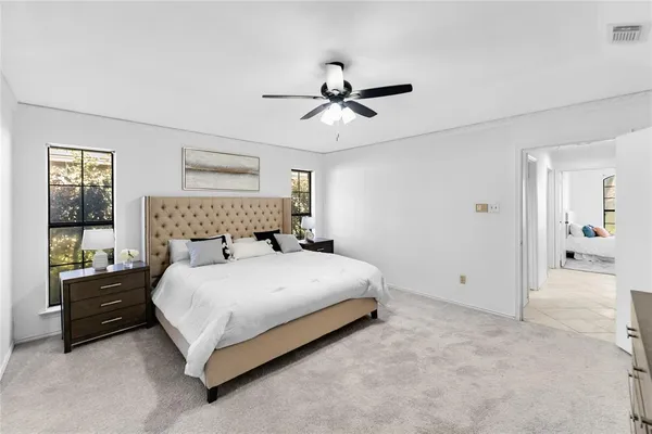 a bedroom with a bed and window