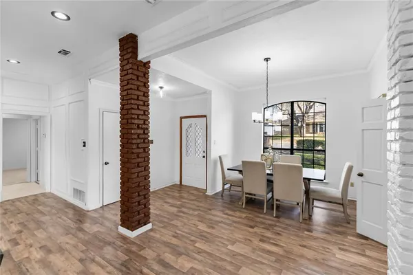 a view of hall with furniture and wooden floor