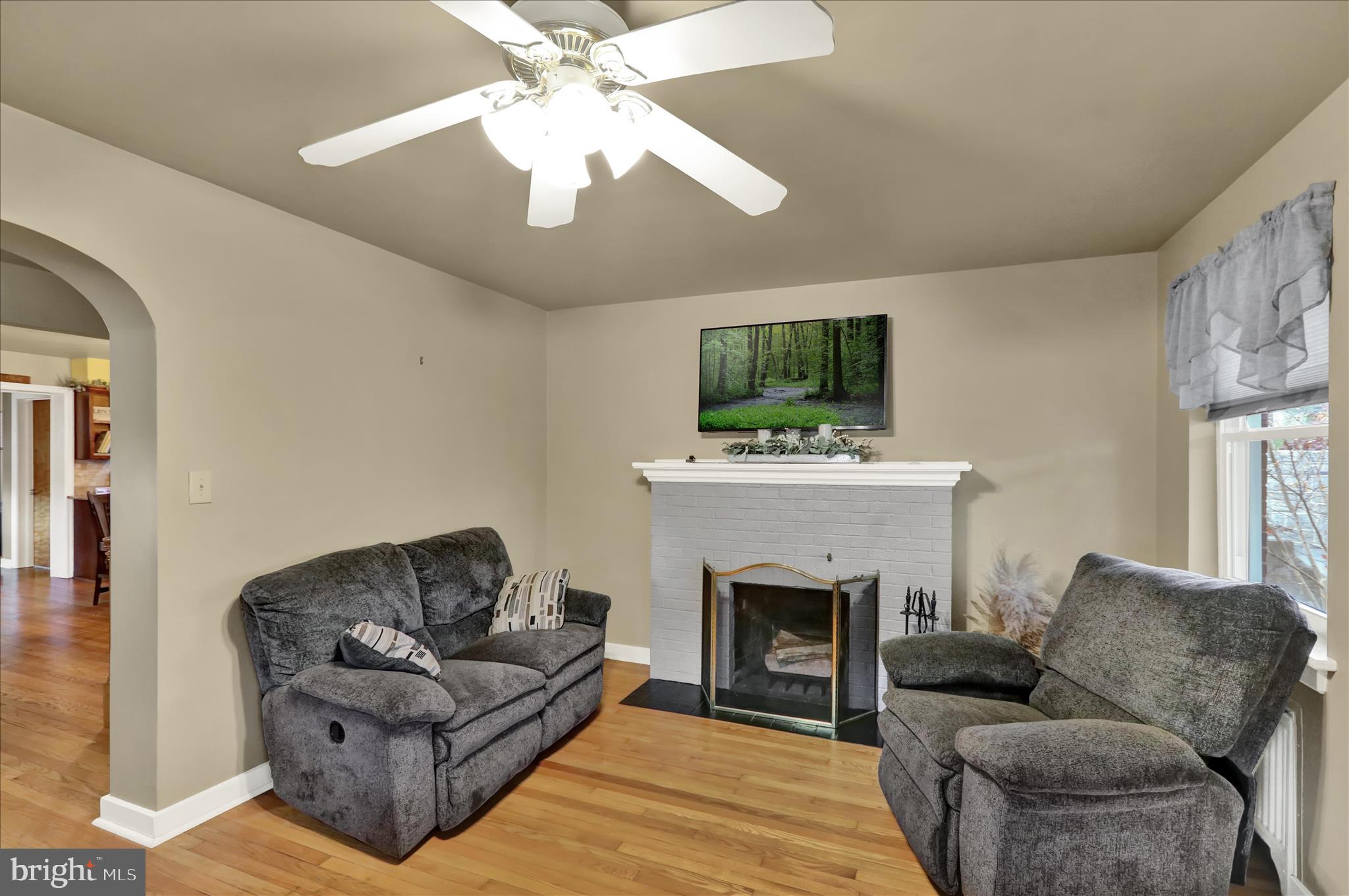 1027 Quentin Road Lebanon, PA 17042 - Photo 11 of 35 a living room with furniture a flat screen tv and a fireplace