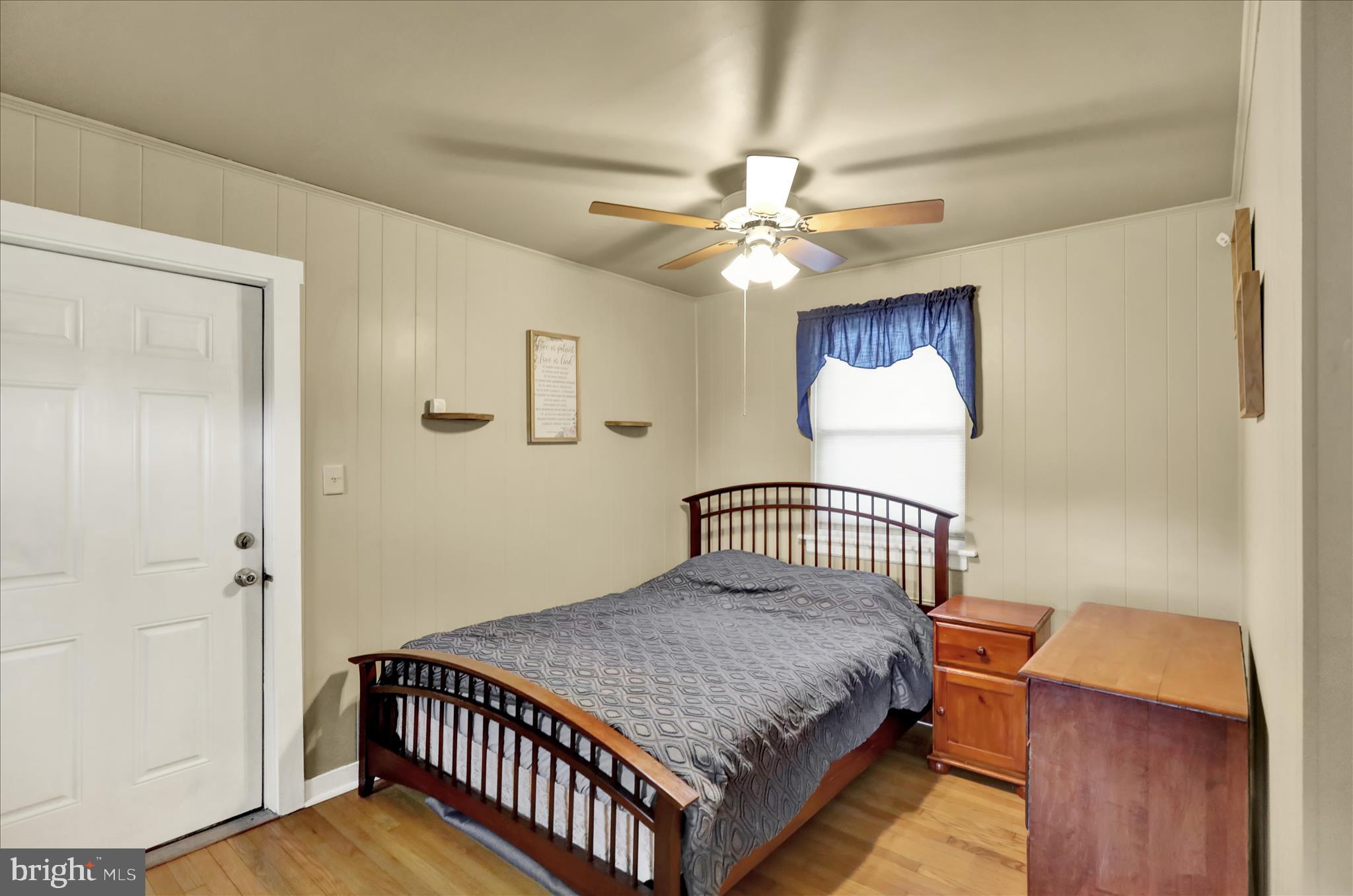 1027 Quentin Road Lebanon, PA 17042 - Photo 12 of 35 a bedroom with a bed and a chandelier