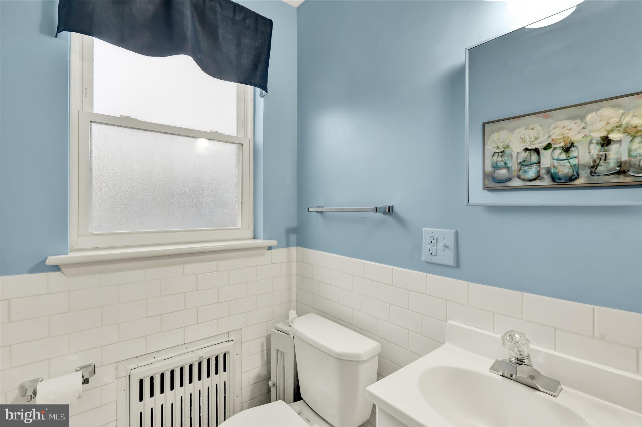 1027 Quentin Road Lebanon, PA 17042 - Photo 13 of 35 a bathroom with a toilet and a sink