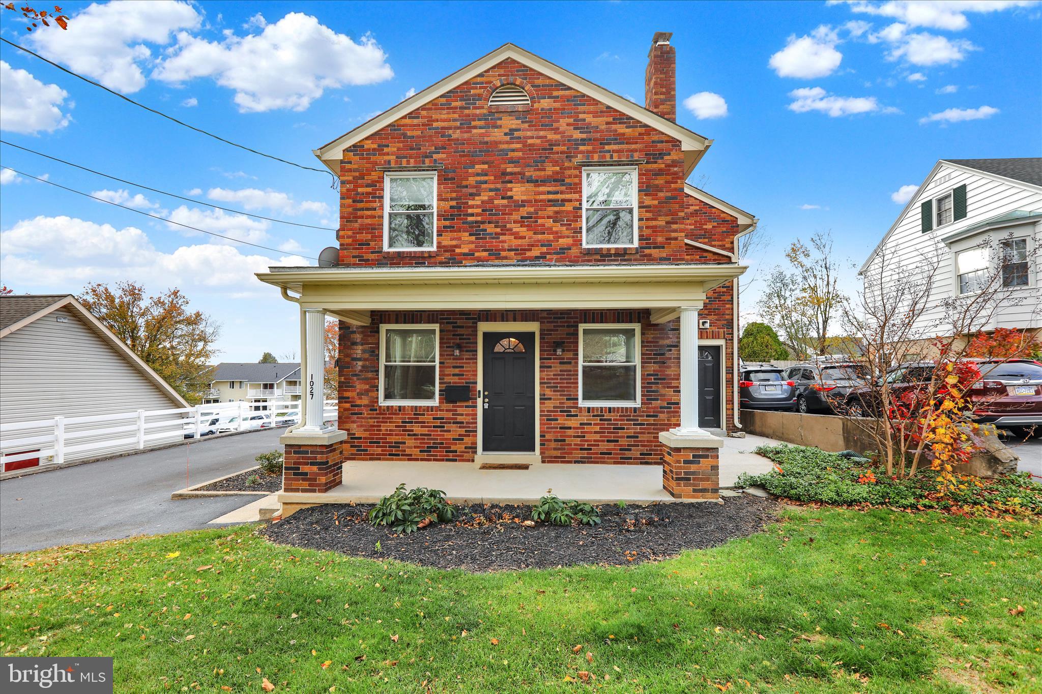 1027 Quentin Road Lebanon, PA 17042 - Photo 31 of 35 a front view of a house with a yard table and chairs