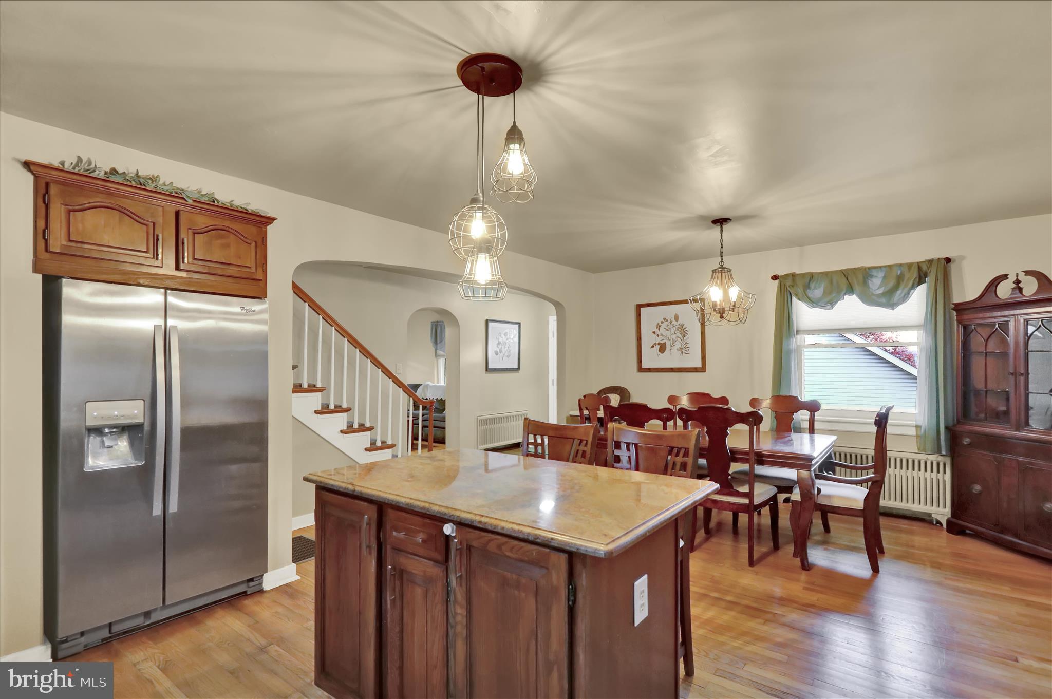1027 Quentin Road Lebanon, PA 17042 - Photo 4 of 35 a kitchen with stainless steel appliances a table chairs and chandelier