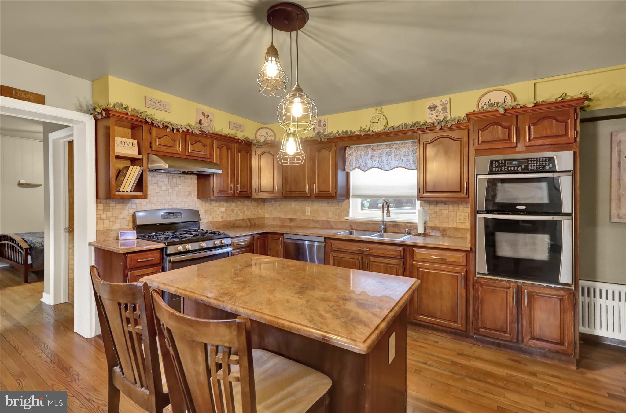 1027 Quentin Road Lebanon, PA 17042 - Photo 5 of 35 a kitchen with stainless steel appliances granite countertop a sink a stove and a refrigerator
