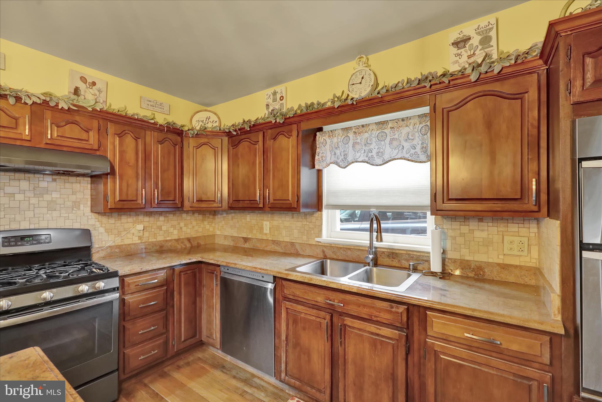 1027 Quentin Road Lebanon, PA 17042 - Photo 6 of 35 a kitchen with a sink stove and cabinets