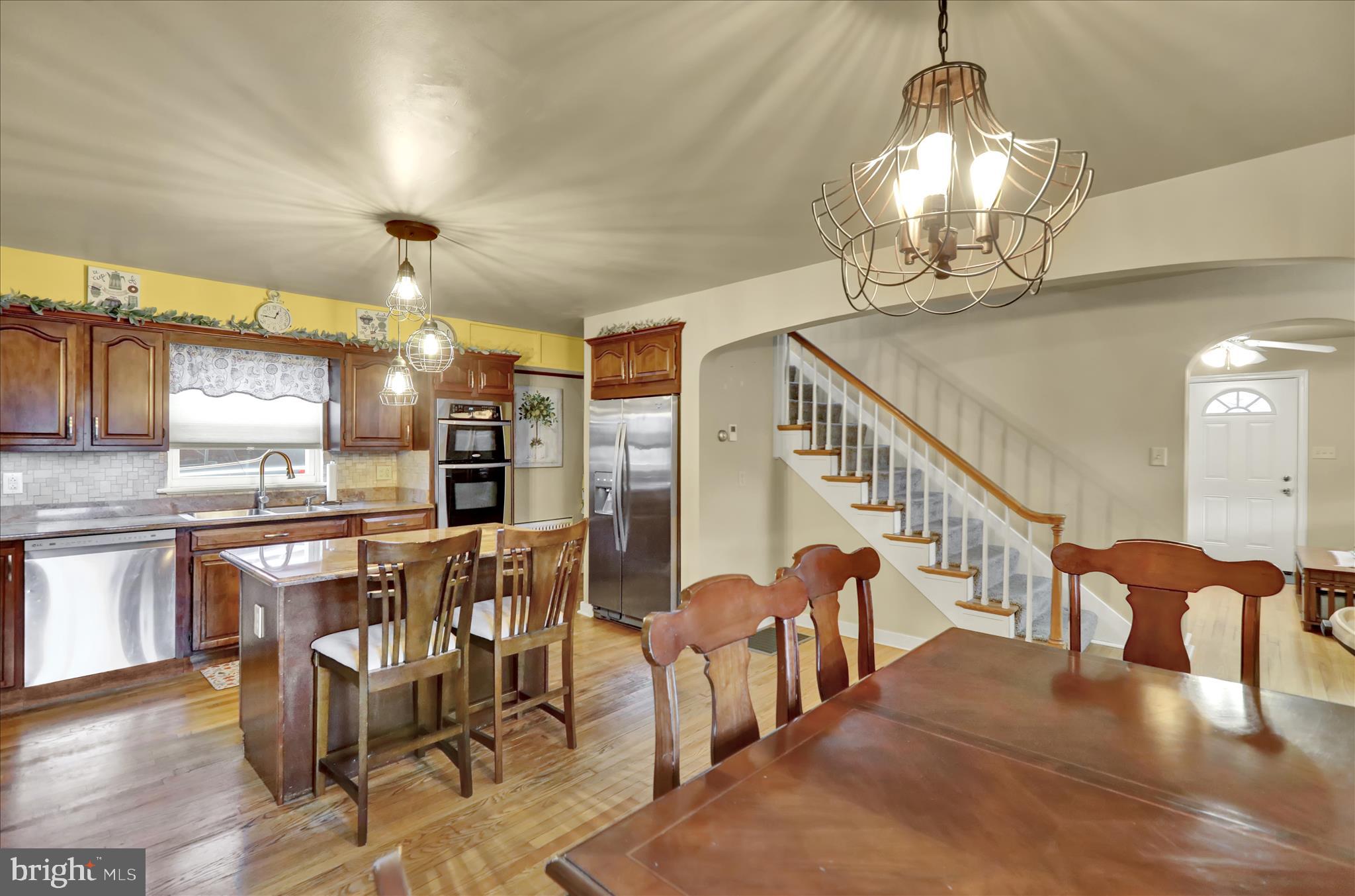 1027 Quentin Road Lebanon, PA 17042 - Photo 7 of 35 a dining hall with lots of chairs and wooden floor