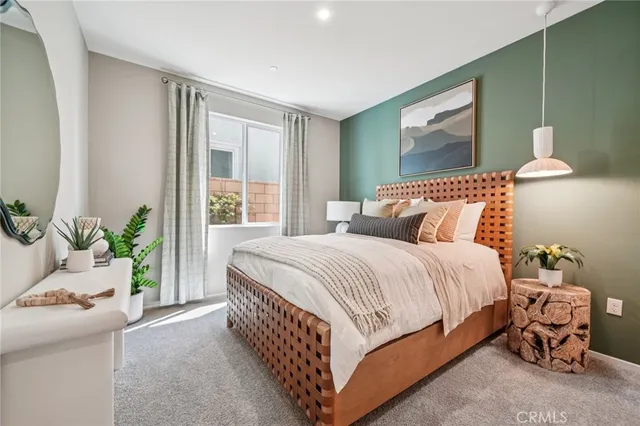 a bedroom with a bed and window