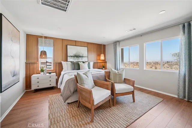 a dining room with furniture and wooden floor