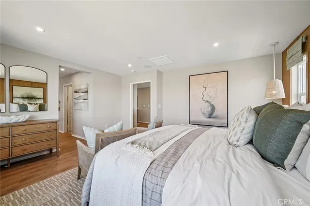 a bedroom with furniture and a window