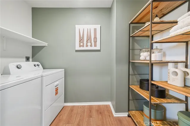 a white toilet sitting next to a bath tub