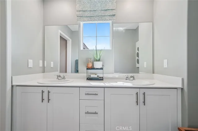 a bedroom with a bed and lamp