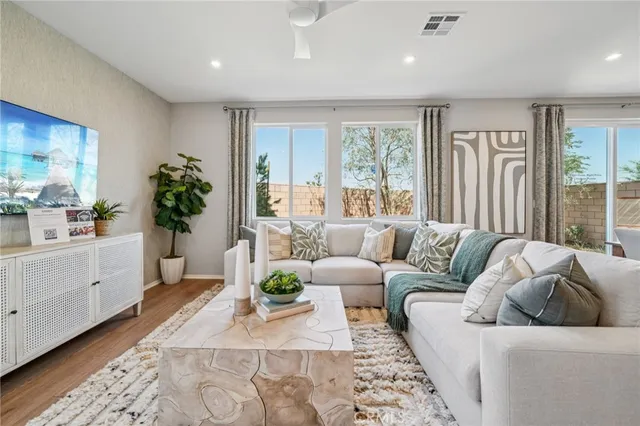 a living room with furniture and a large window