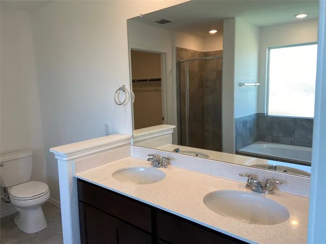 a view of a backyard with table and chairs