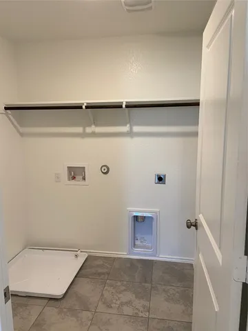 a kitchen with granite countertop wooden cabinets and stainless steel appliances