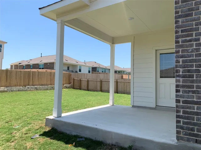 a kitchen with stainless steel appliances a refrigerator and wooden cabinets