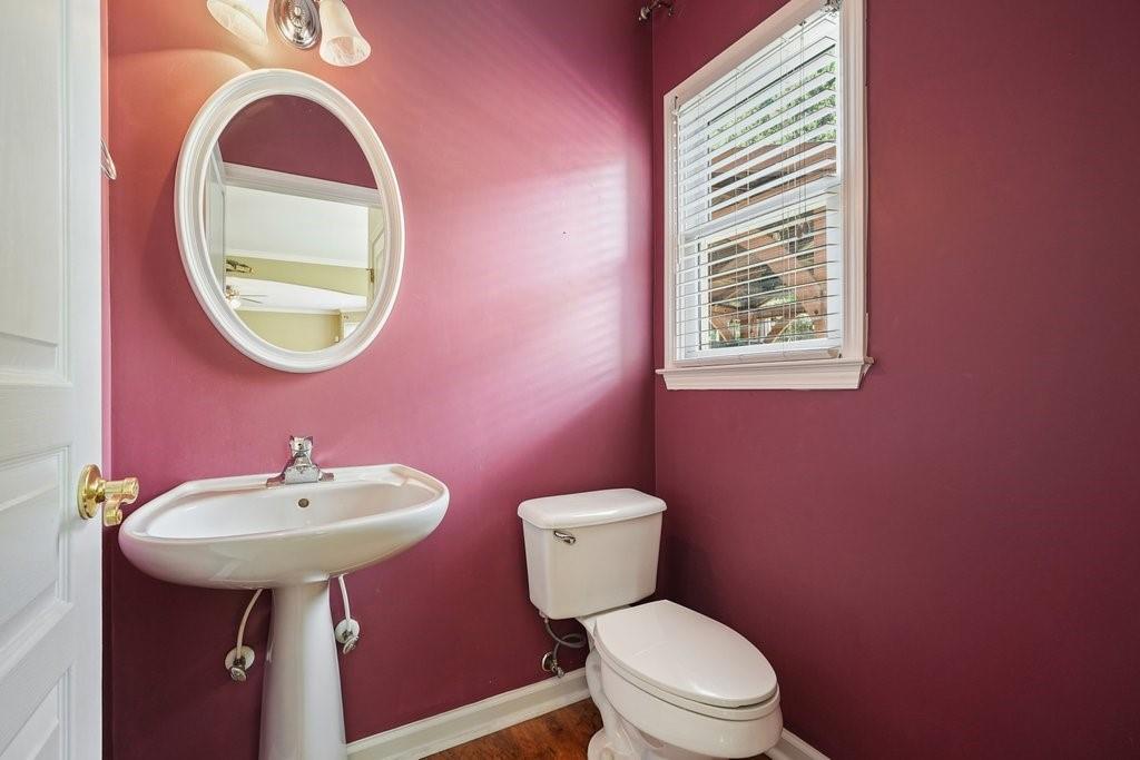 412 Middlebrooke Street Canton, GA 30115 - Photo 15 of 32 a bathroom with a toilet sink and mirror