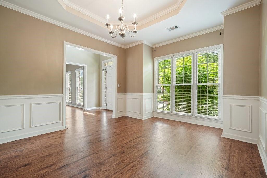 412 Middlebrooke Street Canton, GA 30115 - Photo 16 of 32 a view of an empty room with wooden floor and a window