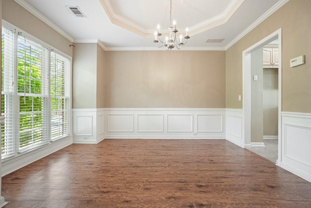 412 Middlebrooke Street Canton, GA 30115 - Photo 17 of 32 a view of empty room with wooden floor and fan