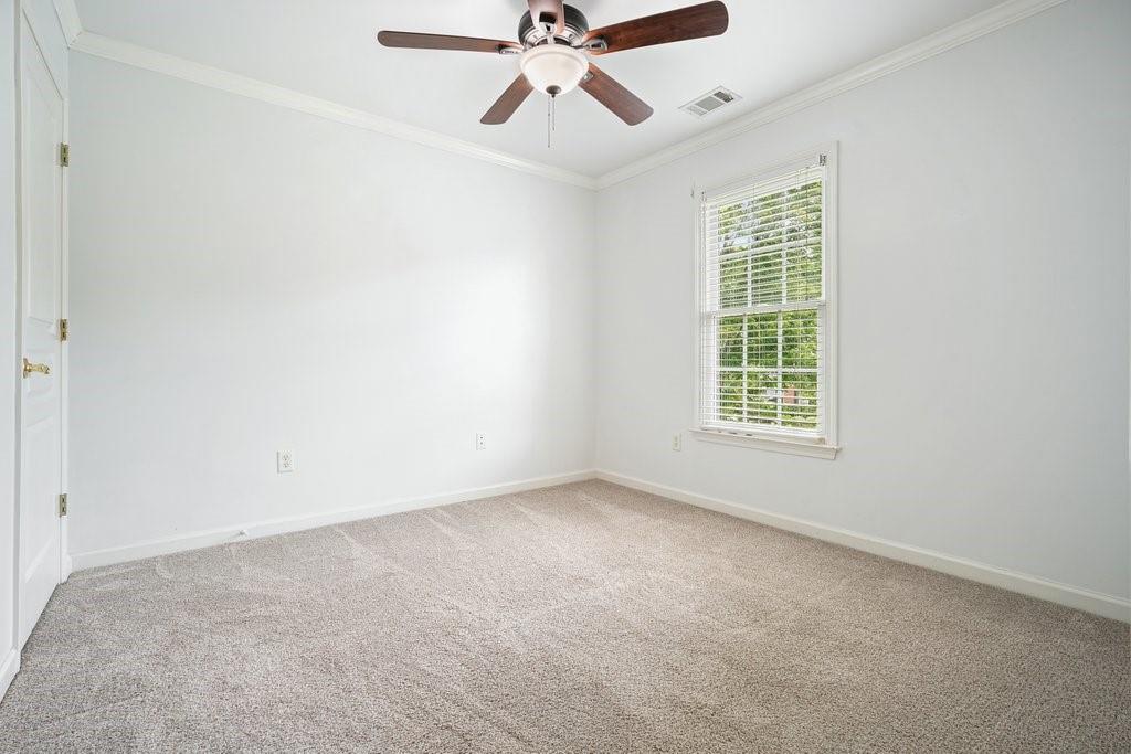 412 Middlebrooke Street Canton, GA 30115 - Photo 19 of 32 an empty room with a window and a fan