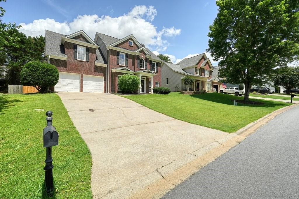 412 Middlebrooke Street Canton, GA 30115 - Photo 2 of 32 a front view of a house with a yard