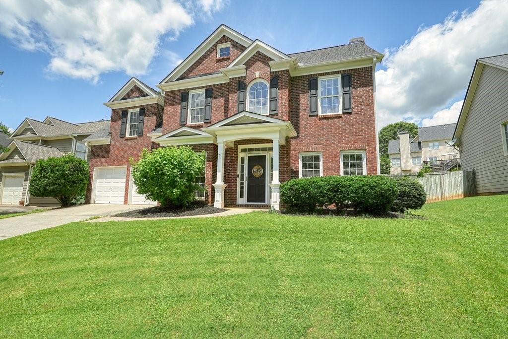 412 Middlebrooke Street Canton, GA 30115 - Photo 3 of 32 a front view of a house with a yard