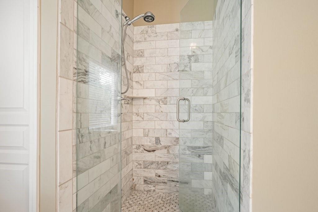 412 Middlebrooke Street Canton, GA 30115 - Photo 31 of 32 a bathroom with a shower