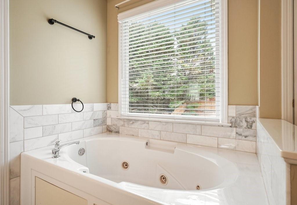 412 Middlebrooke Street Canton, GA 30115 - Photo 32 of 32 a white bath tub sitting next to a window