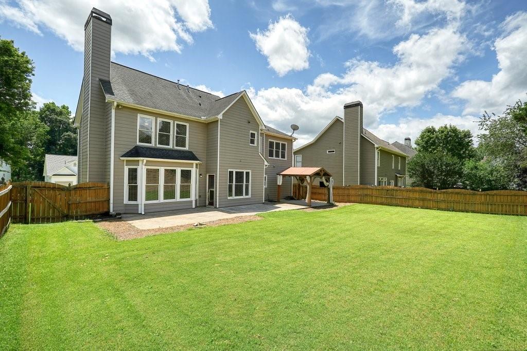 412 Middlebrooke Street Canton, GA 30115 - Photo 4 of 32 a view of a house with a yard