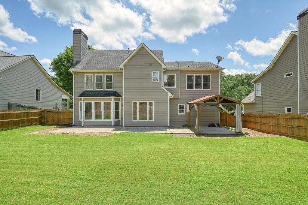 412 Middlebrooke Street Canton, GA 30115 - Photo 5 of 32 a front view of a house with a yard and garage