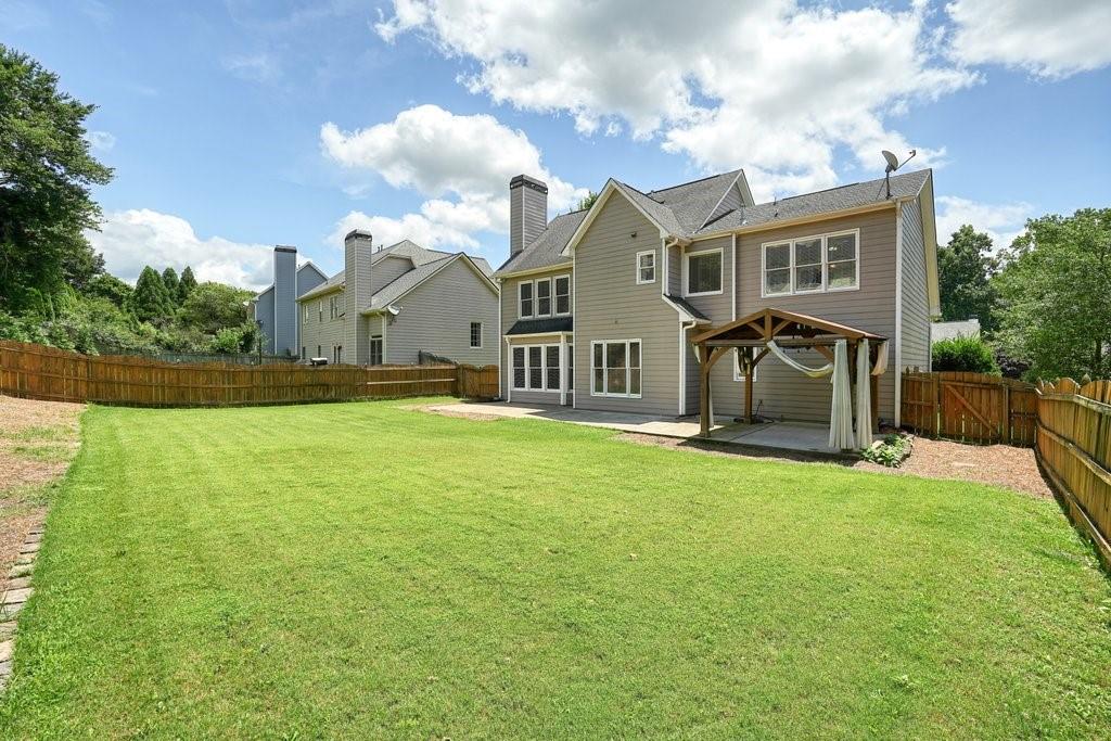 412 Middlebrooke Street Canton, GA 30115 - Photo 6 of 32 a front view of house with yard and green space