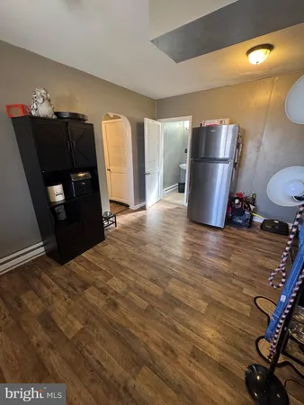 a kitchen with a refrigerator and a stove